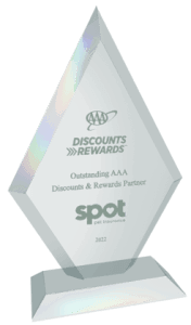 A transparent, diamond-shaped award from 2022 reads "Discounts: Outstanding AAA Discounts & Rewards Partner" with the "spot part integration" logo at the base.