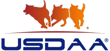 USDAA logo featuring three abstract dogs in motion with orange and red gradients.